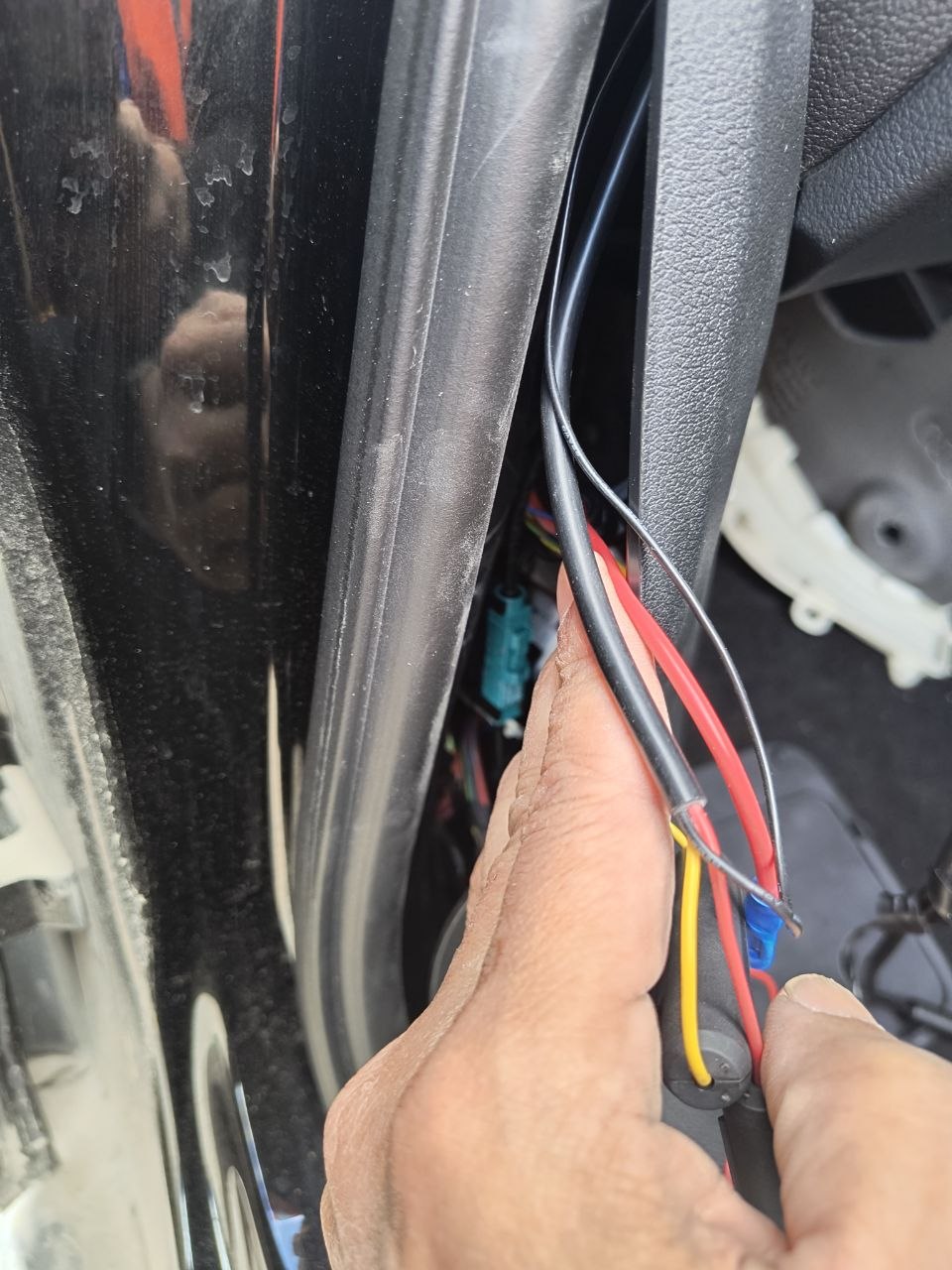 Interior of the written-off car at Copart Sandwich, showing a deployed passenger airbag draped over the dashboard and a shattered windscreen, the kind of impact that put the car here.